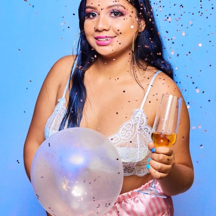 Kaveri Mehta, Lead Design Curator at Timber Grove Panel, reviewing corporate floral arrangements